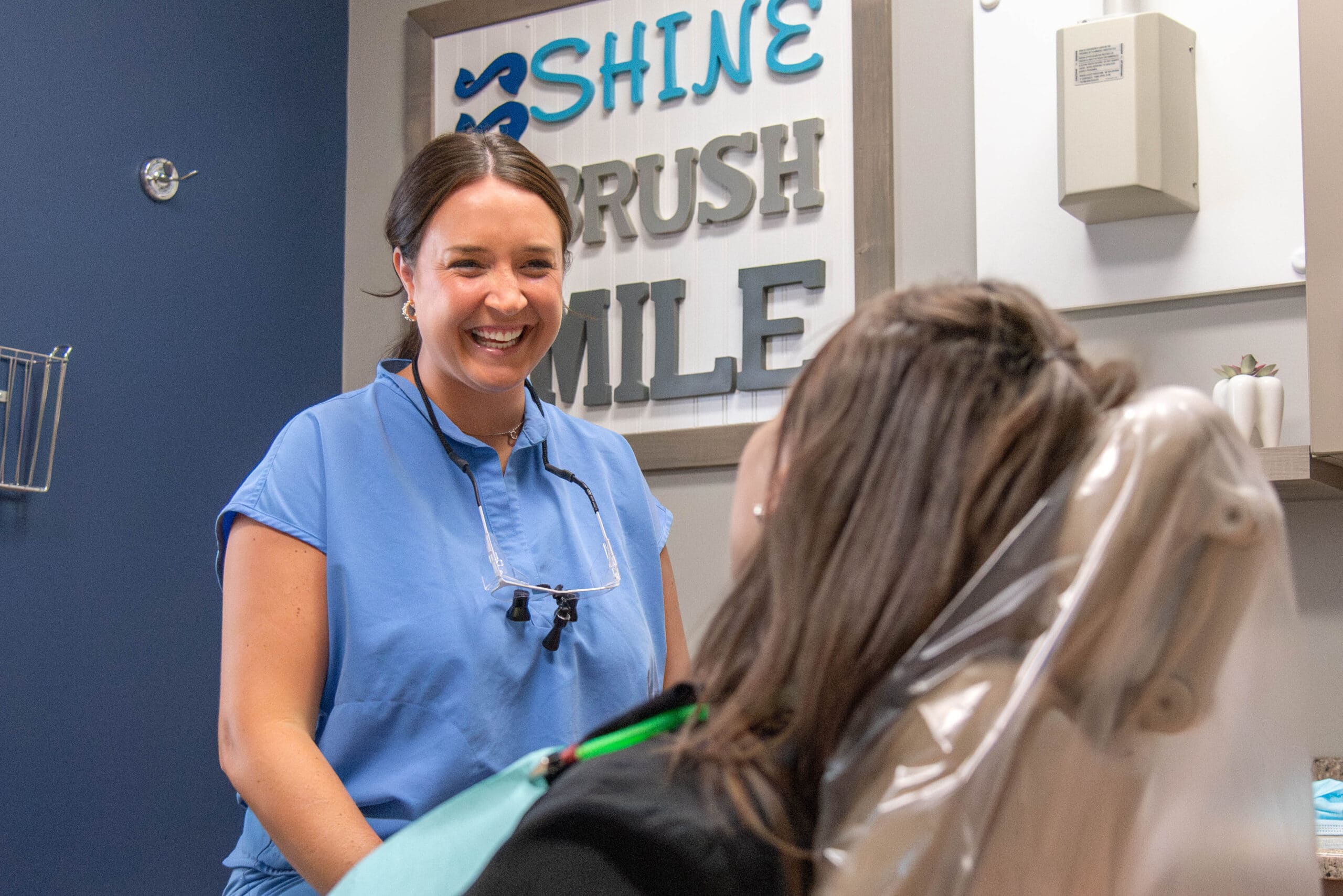 Dr. Courtney with patient o'fallon dental works